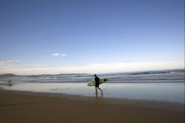 Surfer at Cintsa, Eastern Cape  by South African Tourism